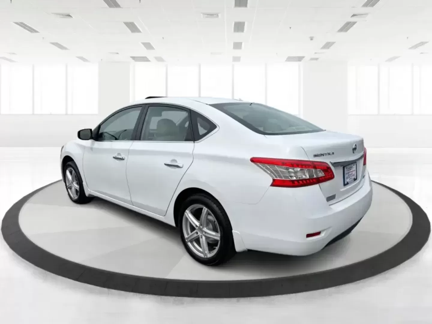 2014 Nissan Sentra SL (3N1AB7AP6EY) with an 1.8L I-4 DOHC engine, 6-Speed Manual transmission, located at 1099 N County Rd 25A , Troy, OH, 45373, (937) 908-9800, 40.057079, -84.212883 - Need a dependable commuter that's easy to park downtown, sips regular unleaded, and still feels comfortable for weekend getaways? This 2014 Nissan Sentra SL in Aspen White is a smart pick for Troy-area drivers who want a practical sedan with upscale touches and a driver-engaged feel thanks to its 6- - Photo#4