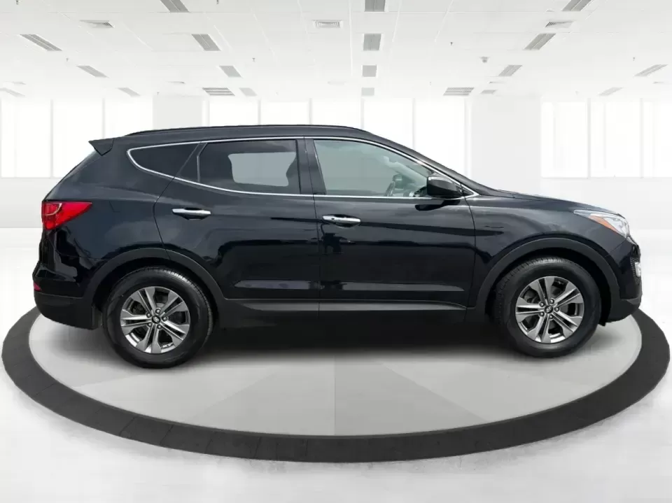 2016 Hyundai Santa Fe 2.4L (5XYZU3LB5GG) with an Theta II 2.4L I-4 gasoline direct injection engine, 6-Speed Automatic transmission, located at 8750 N County Rd 25A, Piqua, OH, 45356, (937) 908-9800, 40.164391, -84.232513 - Load up the family, point the hood toward a weekend at John Bryan State Park, or make the daily commute from Xenia to Beavercreek feel more comfortable-this 2016 Hyundai Santa Fe 2.4L is the kind of SUV that fits real life. With three-row versatility in a right-sized footprint, it's ideal for school - Photo#1
