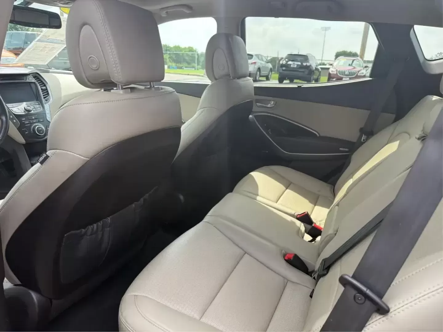 2016 Hyundai Santa Fe 2.4L (5XYZU3LB5GG) with an Theta II 2.4L I-4 gasoline direct injection engine, 6-Speed Automatic transmission, located at 1951 S Dayton Lakeview Rd., New Carlisle, OH, 45344, (937) 908-9800, 39.890999, -84.050255 - Load up the family, point the hood toward a weekend at John Bryan State Park, or make the daily commute from Xenia to Beavercreek feel more comfortable-this 2016 Hyundai Santa Fe 2.4L is the kind of SUV that fits real life. With three-row versatility in a right-sized footprint, it's ideal for school - Photo#10