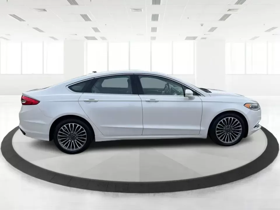 2017 Ford Fusion SE AWD (3FA6P0T99HR) with an 2.0L L4 DOHC 16V engine, 6A transmission, located at 1230 East Main St, Xenia, OH, 45385, (937) 908-9800, 39.688026, -83.910172 - Need a dependable sedan for the daily drive from Xenia to Beavercreek, Wright-Patterson AFB, or downtown Dayton-while still being comfortable enough for weekend trips to John Bryan State Park or a night out near the Greene? This 2017 Ford Fusion SE in Oxford White is a smart, commuter-friendly choic - Photo#1