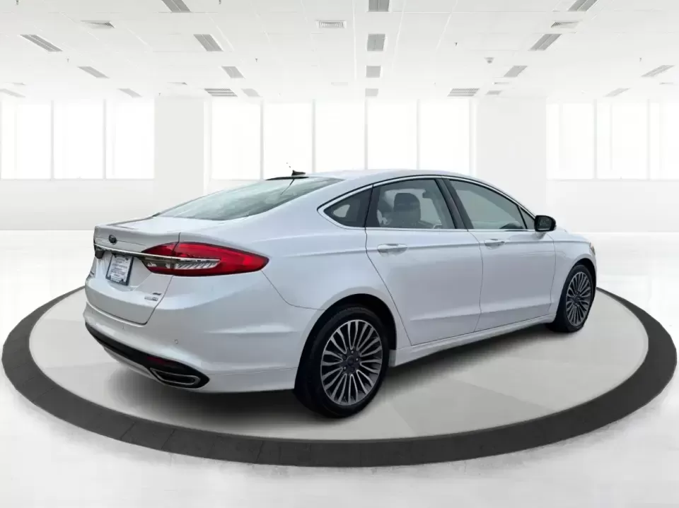 2017 Ford Fusion SE AWD (3FA6P0T99HR) with an 2.0L L4 DOHC 16V engine, 6A transmission, located at 1230 East Main St, Xenia, OH, 45385, (937) 908-9800, 39.688026, -83.910172 - Need a dependable sedan for the daily drive from Xenia to Beavercreek, Wright-Patterson AFB, or downtown Dayton-while still being comfortable enough for weekend trips to John Bryan State Park or a night out near the Greene? This 2017 Ford Fusion SE in Oxford White is a smart, commuter-friendly choic - Photo#2