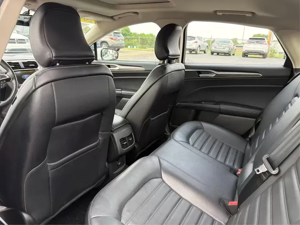 2017 Ford Fusion SE AWD (3FA6P0T99HR) with an 2.0L L4 DOHC 16V engine, 6A transmission, located at 1230 East Main St, Xenia, OH, 45385, (937) 908-9800, 39.688026, -83.910172 - Need a dependable sedan for the daily drive from Xenia to Beavercreek, Wright-Patterson AFB, or downtown Dayton-while still being comfortable enough for weekend trips to John Bryan State Park or a night out near the Greene? This 2017 Ford Fusion SE in Oxford White is a smart, commuter-friendly choic - Photo#10