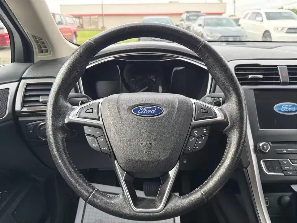 2017 Ford Fusion SE AWD (3FA6P0T99HR) with an 2.0L L4 DOHC 16V engine, 6A transmission, located at 1230 East Main St, Xenia, OH, 45385, (937) 908-9800, 39.688026, -83.910172 - Need a dependable sedan for the daily drive from Xenia to Beavercreek, Wright-Patterson AFB, or downtown Dayton-while still being comfortable enough for weekend trips to John Bryan State Park or a night out near the Greene? This 2017 Ford Fusion SE in Oxford White is a smart, commuter-friendly choic - Photo#16