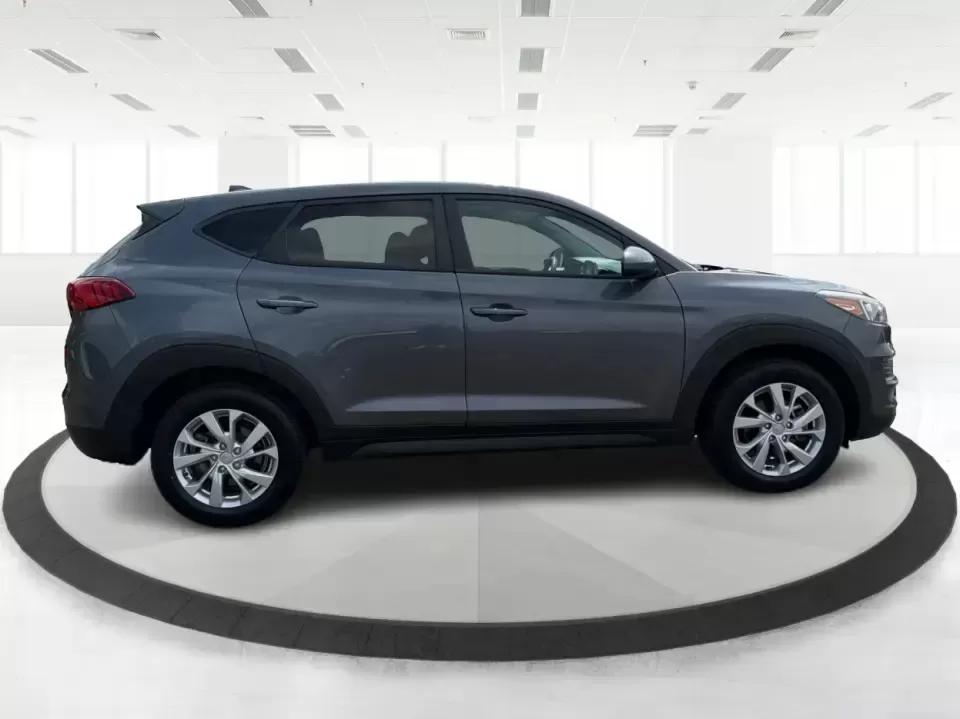2019 Hyundai Tucson SE AWD (KM8J2CA47KU) with an 2.0L L4 DOHC 16V engine, 6A transmission, located at 1099 N County Rd 25A , Troy, OH, 45373, (937) 908-9800, 40.057079, -84.212883 - Need a dependable SUV that can handle school drop-offs, long commutes up I-75, and spontaneous weekend getaways to Charleston Falls Preserve or a quick lap around the Miami County Fairgrounds? This 2019 Hyundai Tucson SE in Coliseum Gray is a smart, practical choice for drivers who want confident al - Photo#1