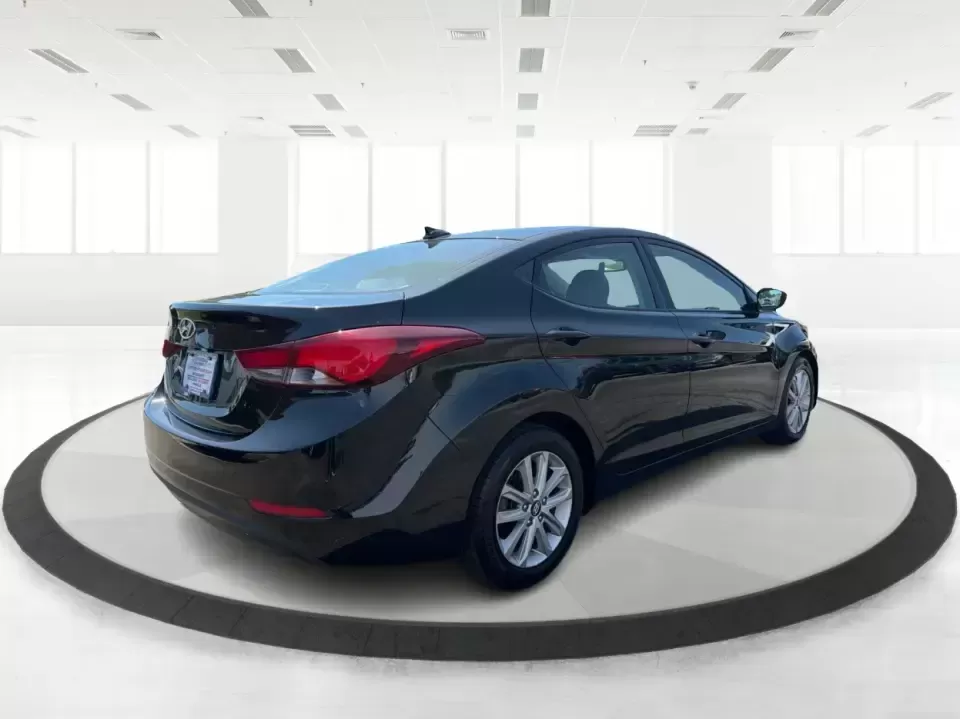 2016 Hyundai Elantra Limited (5NPDH4AE8GH) with an 1.8L L4 DOHC 16V engine, 6-Speed Automatic transmission, located at 4508 South Dixie Dr, Moraine, OH, 45439, (937) 908-9800, 39.689976, -84.218452 - Picture an easy weekday routine: a comfortable, fuel-sipping sedan for the commute down South Dixie Drive, quick school drop-offs, and a smooth Friday escape to Carillon Historical Park or a Dayton Dragons game. This **2016 Hyundai Elantra Limited** in **Phantom Black** is the kind of practical, pol - Photo#2