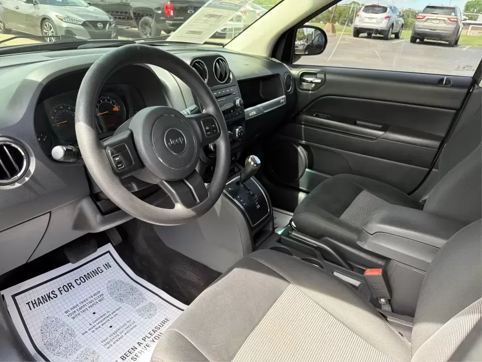 2015 Jeep Compass Sport FWD (1C4NJCBA6FD) with an 2.0L L4 DOHC 16V engine, located at 880 E. National Road, Vandalia, OH, 45377, (937) 908-9800, 39.891918, -84.183594 - Weekday commutes down I75, school drop-offs in Butler Township, and quick weekend getaways to the National Museum of the U.S. Air Force or Taylorsville MetroPark all call for an SUV that's easy to live with, comfortable for five, and efficient enough to keep your budget in check. This **2015 Jeep Co - Photo#9