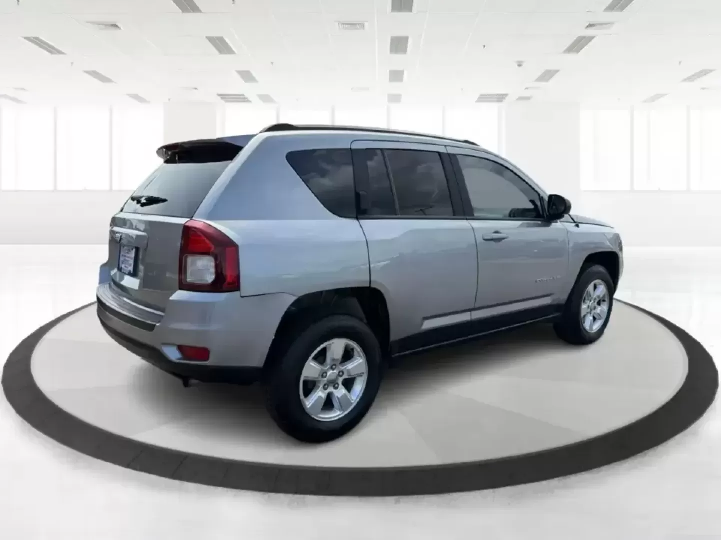 2015 Jeep Compass Sport FWD (1C4NJCBA6FD) with an 2.0L L4 DOHC 16V engine, located at 1951 S Dayton Lakeview Rd., New Carlisle, OH, 45344, (937) 908-9800, 39.890999, -84.050255 - Whether your week looks like a daily commute down I70, school drop-offs around Clark County, or a quick weekend escape to Buck Creek State Park, this **2015 Jeep Compass Sport FWD** is the kind of compact SUV that fits real life. With seating for **five**, easy-to-park sizing, and the versatile carg- Photo#2