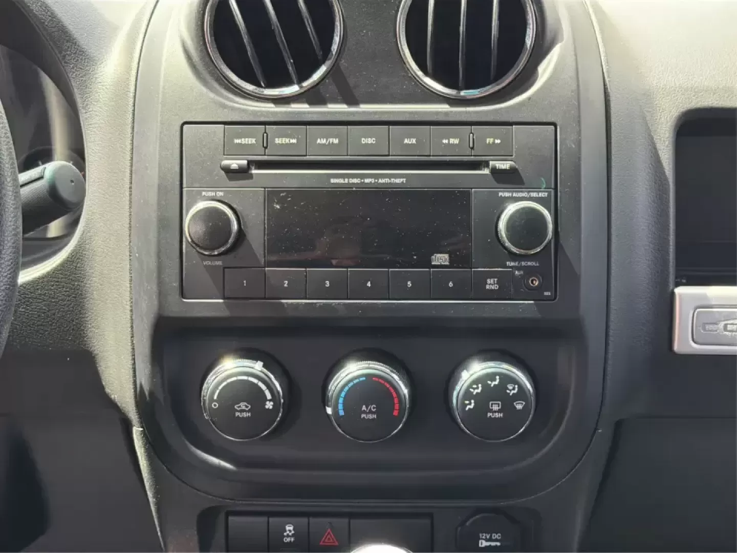 2015 Jeep Compass Sport FWD (1C4NJCBA6FD) with an 2.0L L4 DOHC 16V engine, located at 1951 S Dayton Lakeview Rd., New Carlisle, OH, 45344, (937) 908-9800, 39.890999, -84.050255 - Whether your week looks like a daily commute down I70, school drop-offs around Clark County, or a quick weekend escape to Buck Creek State Park, this **2015 Jeep Compass Sport FWD** is the kind of compact SUV that fits real life. With seating for **five**, easy-to-park sizing, and the versatile carg- Photo#13
