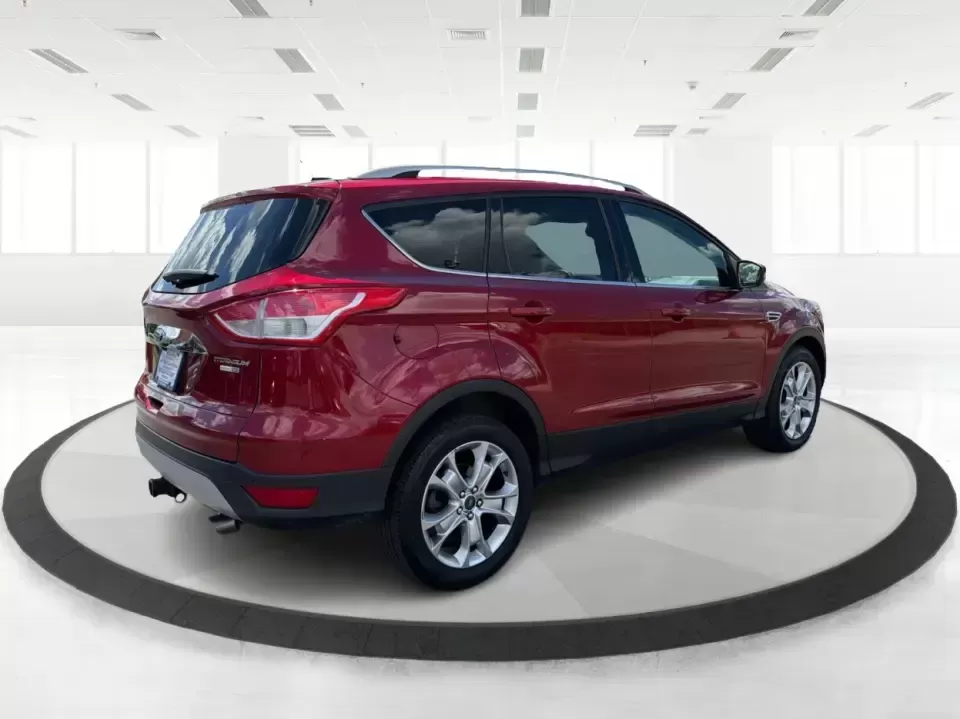 2014 Ford Escape Titanium 4WD (1FMCU9J91EU) with an 2.0L L4 DOHC 16V engine, 6-Speed Automatic transmission, located at 1099 N County Rd 25A , Troy, OH, 45373, (937) 908-9800, 40.057079, -84.212883 - Weekend getaways to Hocking Hills, snowy commutes up I75, or the everyday school-and-grocery loop around Troy-this 2014 Ford Escape Titanium 4WD is built for the kind of life that doesn't slow down when the weather changes. With seating for five, flexible cargo space, and confident four-wheel drive,- Photo#2