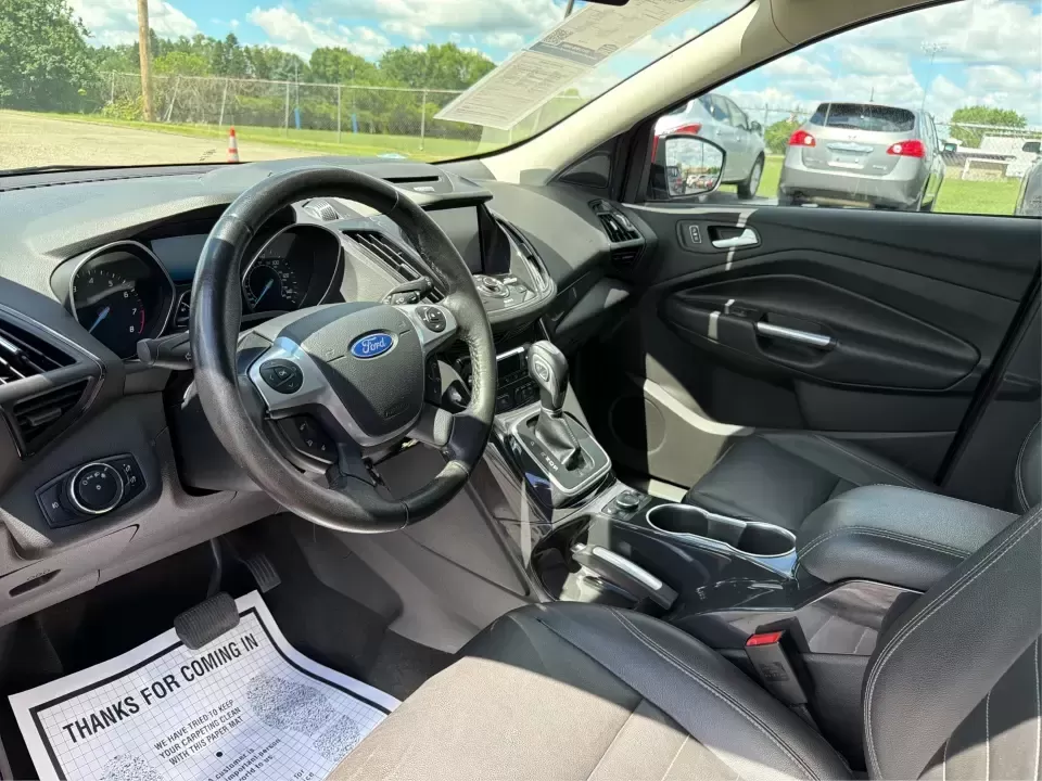 2014 Ford Escape Titanium 4WD (1FMCU9J91EU) with an 2.0L L4 DOHC 16V engine, 6-Speed Automatic transmission, located at 1099 N County Rd 25A , Troy, OH, 45373, (937) 908-9800, 40.057079, -84.212883 - Weekend getaways to Hocking Hills, snowy commutes up I75, or the everyday school-and-grocery loop around Troy-this 2014 Ford Escape Titanium 4WD is built for the kind of life that doesn't slow down when the weather changes. With seating for five, flexible cargo space, and confident four-wheel drive,- Photo#9