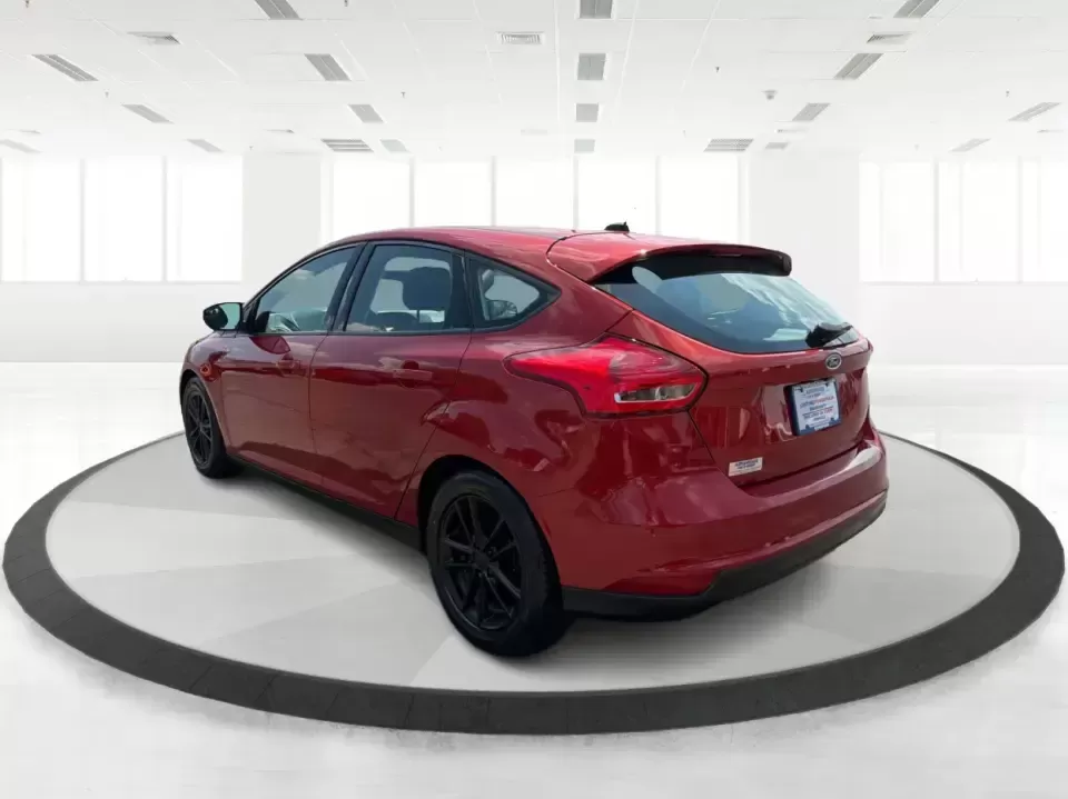 2018 Ford Focus SE (1FADP3K27JL) with an 2L I-4 gasoline direct injection engine, Automatic transmission, located at 4508 South Dixie Dr, Moraine, OH, 45439, (937) 908-9800, 39.689976, -84.218452 - Need a practical, fun-to-drive hatchback for the daily commute down South Dixie Drive, quick errands near Dayton Mall, or an easy weekend escape to Carillon Historical Park? This 2018 Ford Focus SE in eye-catching Hot Pepper Red Metallic Tinted Clearcoat fits real life in Moraine, Ohio-compact enoug- Photo#4
