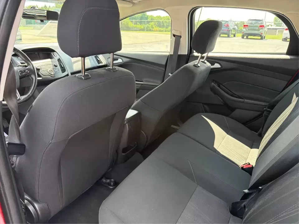 2018 Ford Focus SE (1FADP3K27JL) with an 2L I-4 gasoline direct injection engine, Automatic transmission, located at 4508 South Dixie Dr, Moraine, OH, 45439, (937) 908-9800, 39.689976, -84.218452 - Need a practical, fun-to-drive hatchback for the daily commute down South Dixie Drive, quick errands near Dayton Mall, or an easy weekend escape to Carillon Historical Park? This 2018 Ford Focus SE in eye-catching Hot Pepper Red Metallic Tinted Clearcoat fits real life in Moraine, Ohio-compact enoug- Photo#10