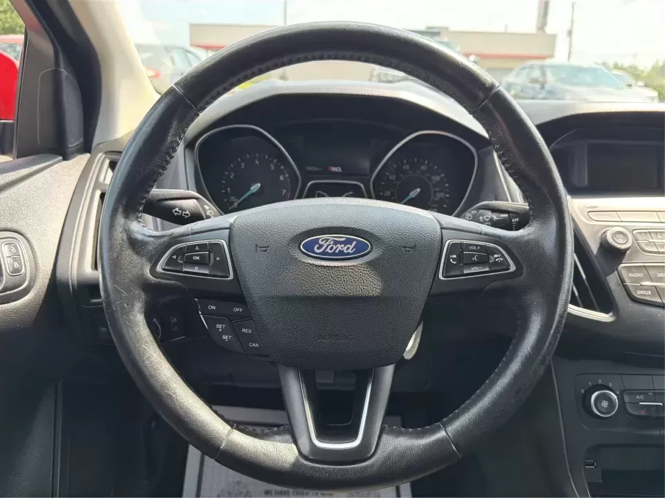 2018 Ford Focus SE (1FADP3K27JL) with an 2L I-4 gasoline direct injection engine, Automatic transmission, located at 4508 South Dixie Dr, Moraine, OH, 45439, (937) 908-9800, 39.689976, -84.218452 - Need a practical, fun-to-drive hatchback for the daily commute down South Dixie Drive, quick errands near Dayton Mall, or an easy weekend escape to Carillon Historical Park? This 2018 Ford Focus SE in eye-catching Hot Pepper Red Metallic Tinted Clearcoat fits real life in Moraine, Ohio-compact enoug- Photo#16