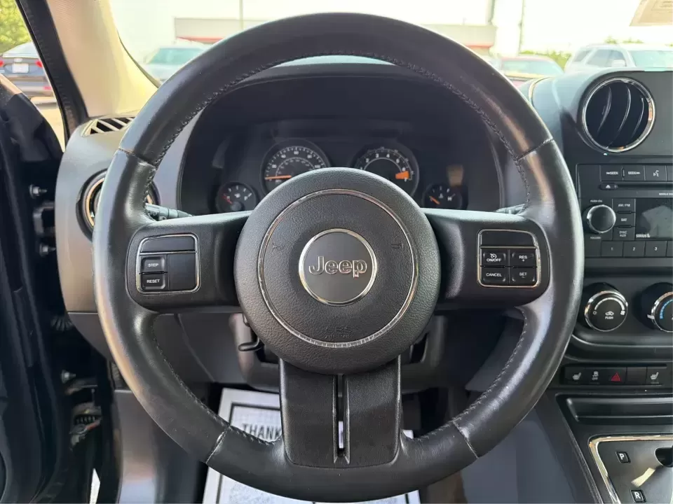 2014 Jeep Patriot Latitude 2WD (1C4NJPFA2ED) with an 2.0L L4 DOHC 16V engine, located at 8750 N County Rd 25A, Piqua, OH, 45356, (937) 908-9800, 40.164391, -84.232513 - Need a practical SUV for school runs, daily commutes to Troy or Dayton, and spontaneous weekend getaways without stretching the budget? This **2014 Jeep Patriot Latitude 2WD** is a smart, flexible choice for drivers who want SUV space, easy-to-live-with comfort, and a straightforward ownership exper- Photo#16