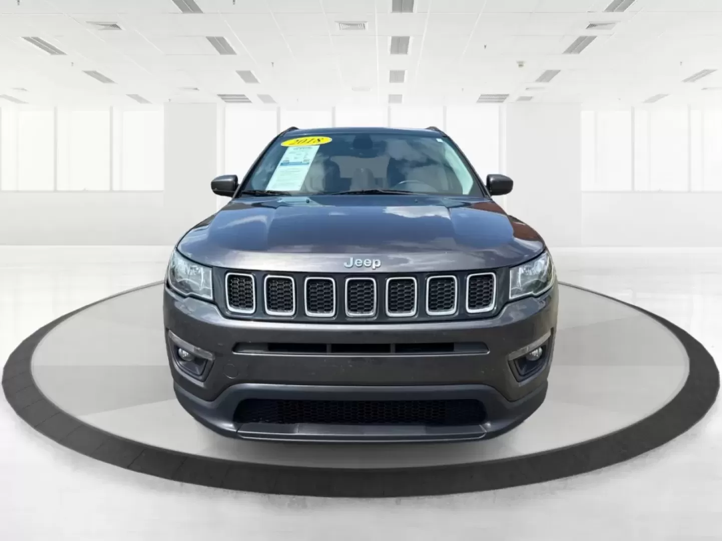 2018 Jeep Compass Latitude FWD (3C4NJCBB1JT) with an 2.4L I-4 variable valve control engine, located at 8750 N County Rd 25A, Piqua, OH, 45356, (937) 908-9800, 40.164391, -84.232513 - **Adventure Awaits with This 2018 Jeep Compass Latitude FWD!**<br /> <br /> Transform your everyday travels into unforgettable adventures with the 2018 Jeep Compass Latitude FWD. This SUV is not just a mode of transportation; it's your ticket to exploration, whether it's cruising through the scenic - Photo#7