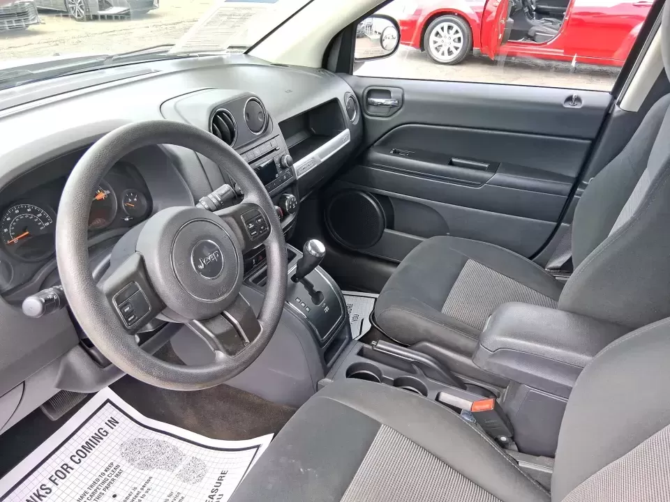 2014 Jeep Compass Sport (1C4NJDBB4ED) with an 2.4L I-4 DOHC engine, Automatic transmission, located at 1230 East Main St, Xenia, OH, 45385, (937) 908-9800, 39.688026, -83.910172 - **Experience Adventure with the 2014 Jeep Compass Sport at Advantage Car and Credit Xenia!** <br /> <br /> Are you ready to embrace the open road with a vehicle that combines comfort, capability, and style? The 2014 Jeep Compass Sport, available at Advantage Car and Credit in Xenia, Ohio, is the pe - Photo#9