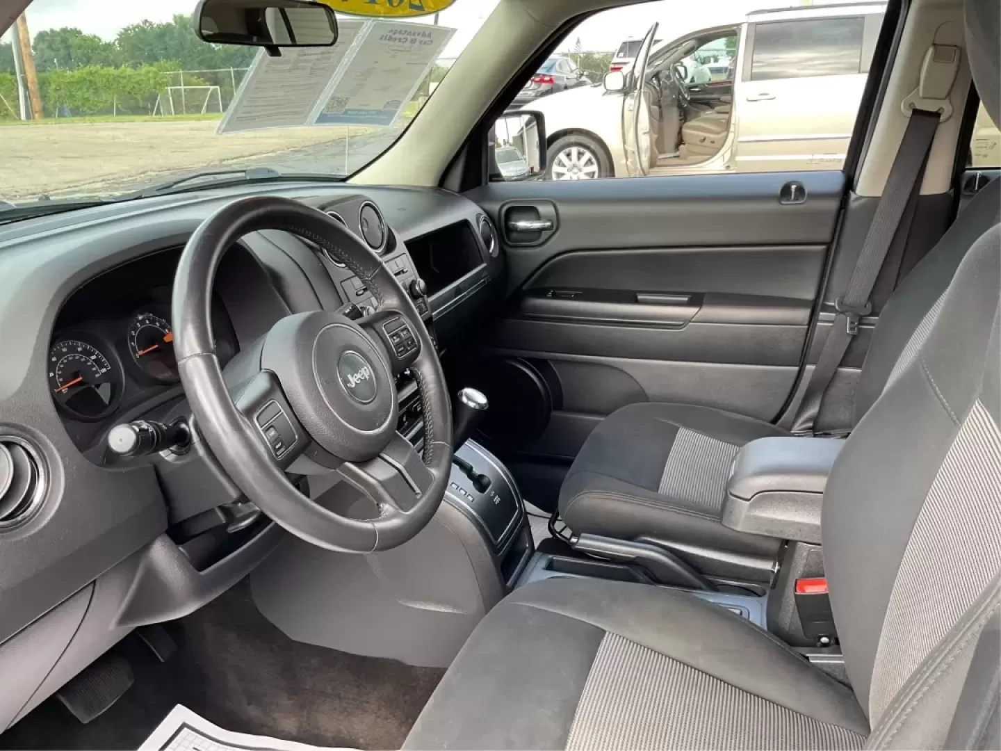2014 Jeep Patriot Latitude (1C4NJPFA4ED) with an Other engine, located at 1099 N County Rd 25A , Troy, OH, 45373, (937) 908-9800, 40.057079, -84.212883 - **Adventure Awaits with This 2014 Jeep Patriot Latitude at Advantage Car and Credit - Moraine!**<br /> <br /> Are you ready to embark on new adventures, whether it's a weekend getaway, a family road trip, or daily commutes? This 2014 Jeep Patriot Latitude is your perfect companion for all these scen - Photo#9