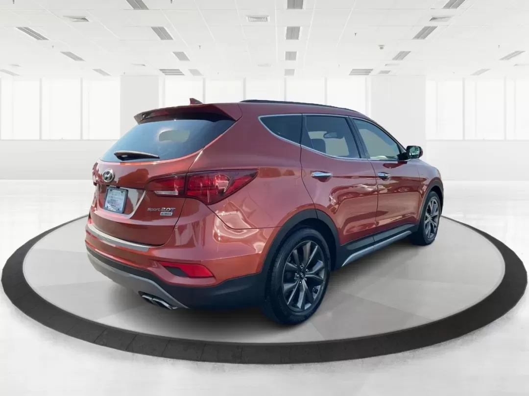 2017 Hyundai Santa Fe 2.0T Ultimate (5XYZW4LA5HG) with an Theta II 2L I-4 gasoline direct injection engine, 6A transmission, located at 8750 N County Rd 25A, Piqua, OH, 45356, (937) 908-9800, 40.164391, -84.232513 - Are you ready to elevate your family adventures or commute comfortably while tackling any road with confidence? Look no further than this 2017 Hyundai Santa Fe 2.0T Ultimate, available now at Advantage Car and Credit in Fairborn, OH. This SUV is not just a vehicle; it's your ticket to creating unfor - Photo#2