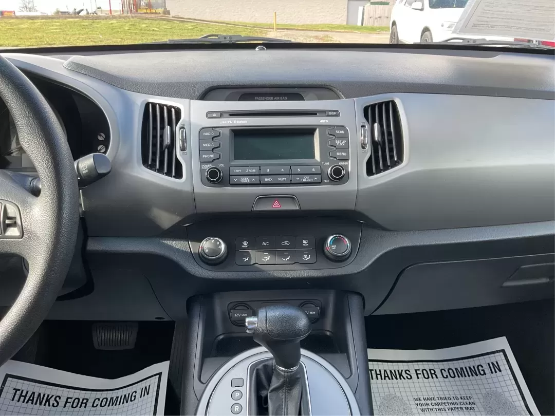 2015 Kia Sportage LX (KNDPB3AC1F7) with an Other engine, located at 8750 N County Rd 25A, Piqua, OH, 45356, (937) 908-9800, 40.164391, -84.232513 - Are you looking for a versatile vehicle that can handle your family's daily adventures while also being budget-friendly? Look no further than this 2015 Kia Sportage LX, now available at Advantage Car and Credit in Fairborn, OH. This stylish crossover SUV is perfect for growing families, weekend geta - Photo#12