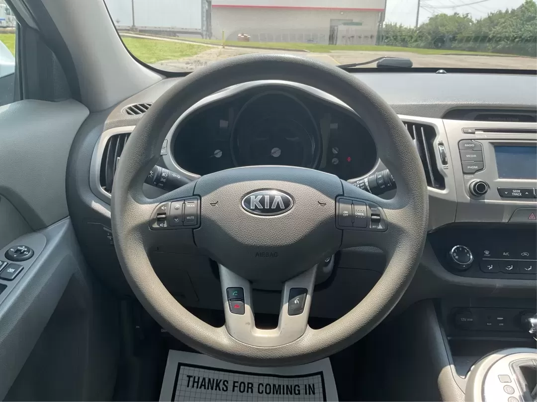 2016 Kia Sportage LX (KNDPBCACXG7) with an Theta II 2.4L I-4 gasoline direct injection engine, 6-Speed Automatic transmission, located at 401 Woodman Dr, Riverside, OH, 45431, (937) 908-9800, 39.760899, -84.123421 - Embrace the journey of life with the 2016 Kia Sportage LX, a vehicle designed for those who thrive on adventure and seek comfort in their daily commute. Whether you're navigating the bustling streets of Fairborn, OH, or embarking on a weekend family getaway, this versatile crossover is your perfect - Photo#16