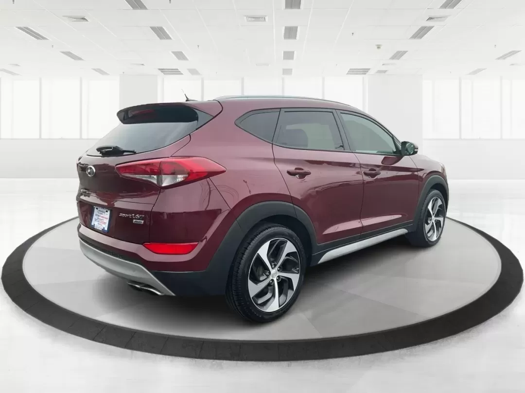 2017 Hyundai Tucson Sport (KM8J3CA29HU) with an 1.6L I-4 gasoline direct injection engine, located at 1951 S Dayton Lakeview Rd., New Carlisle, OH, 45344, (937) 908-9800, 39.890999, -84.050255 - **Discover Adventure in the 2017 Hyundai Tucson: Your Ideal SUV for Every Journey!**<br /> <br /> Are you ready to elevate your driving experience? The 2017 Hyundai Tucson in striking Ruby Wine is here, tailored for those who crave versatility and reliability in their daily adventures. Whether you'r - Photo#2