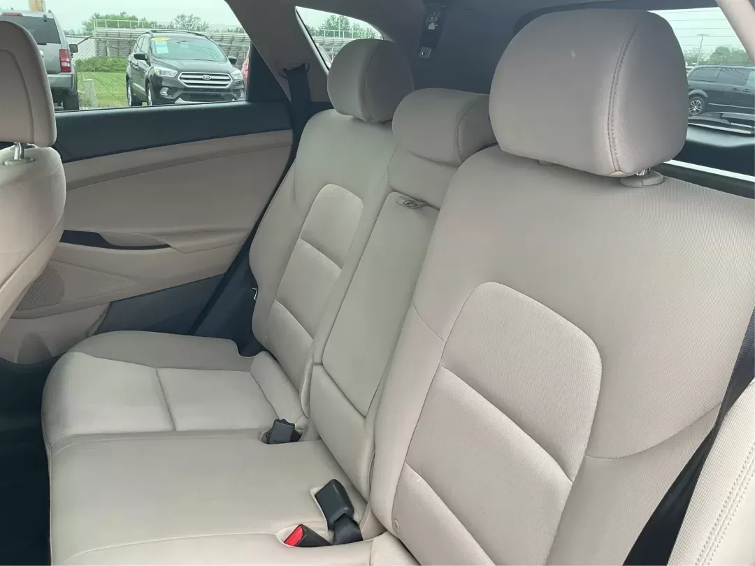 2017 Hyundai Tucson Sport (KM8J3CA29HU) with an 1.6L I-4 gasoline direct injection engine, located at 1951 S Dayton Lakeview Rd., New Carlisle, OH, 45344, (937) 908-9800, 39.890999, -84.050255 - **Discover Adventure in the 2017 Hyundai Tucson: Your Ideal SUV for Every Journey!**<br /> <br /> Are you ready to elevate your driving experience? The 2017 Hyundai Tucson in striking Ruby Wine is here, tailored for those who crave versatility and reliability in their daily adventures. Whether you'r - Photo#10